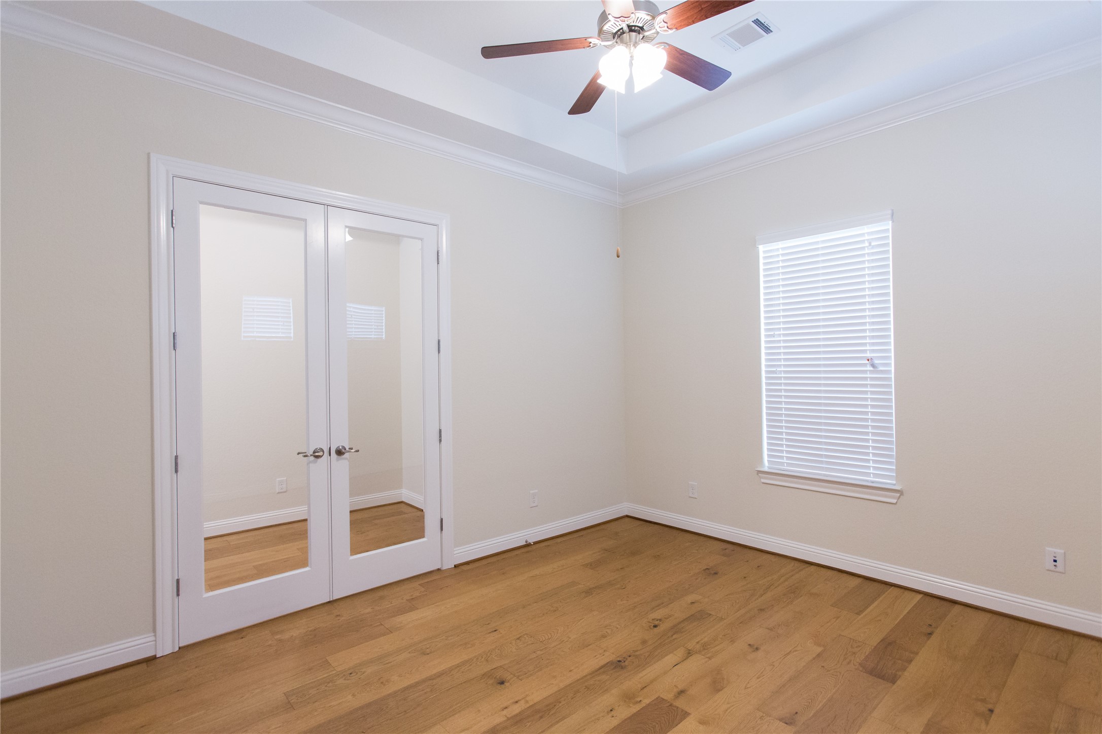7402 Kearney Hill Lane Spring, TX 77389 - Photo 4 of 23 wooden floor in an empty room with a window