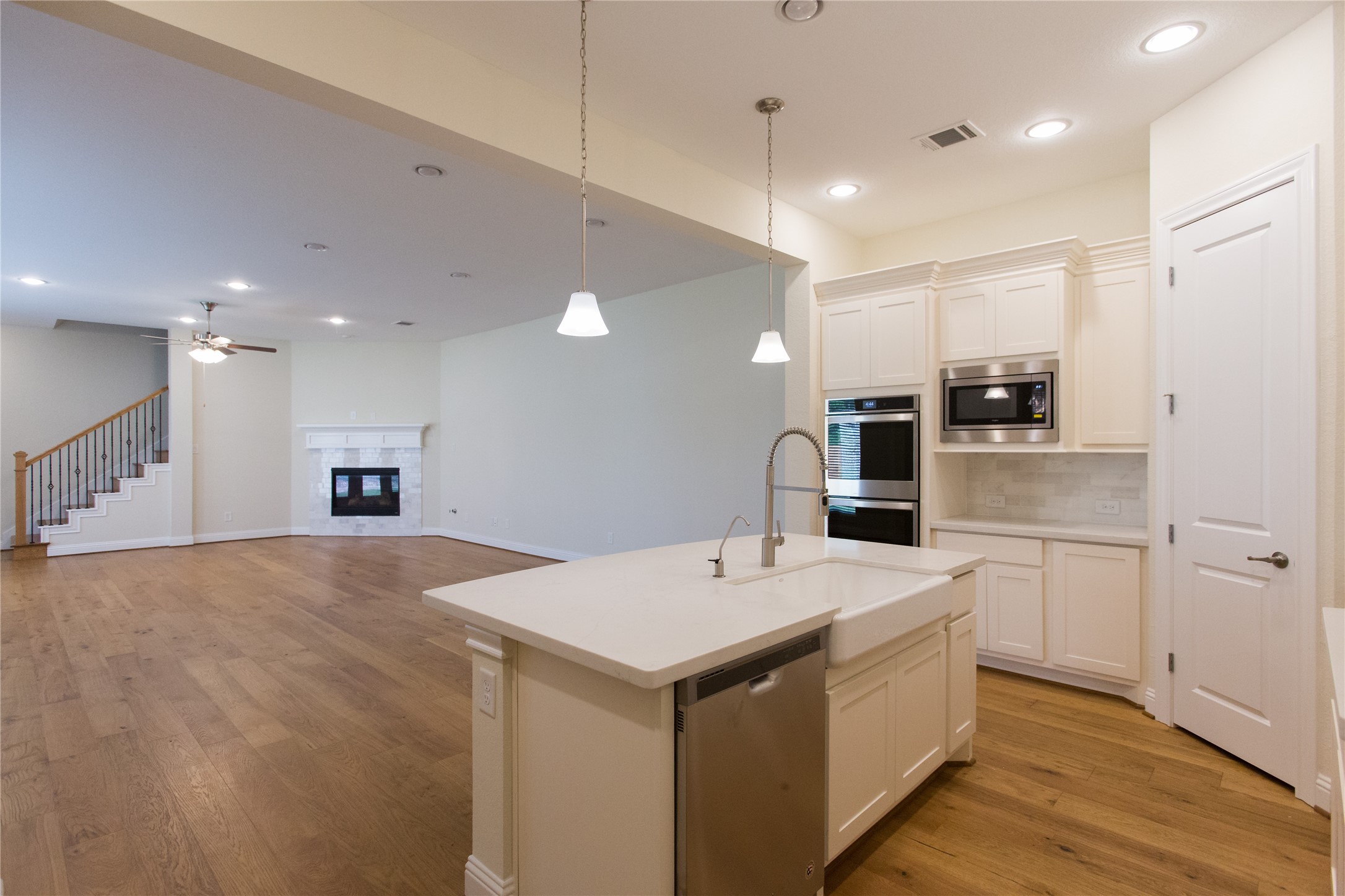 7402 Kearney Hill Lane Spring, TX 77389 - Photo 6 of 23 a kitchen with a sink and a refrigerator