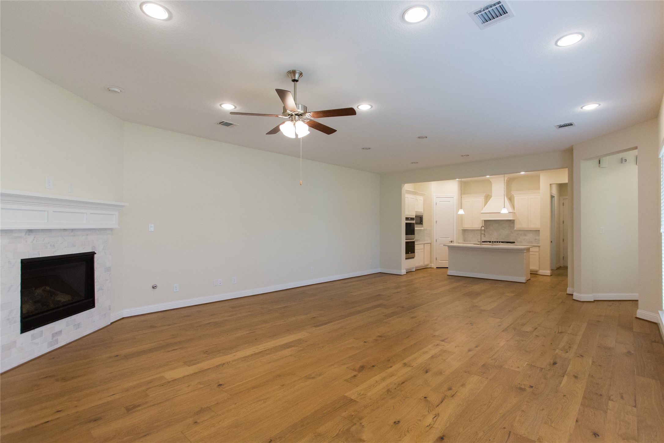 7402 Kearney Hill Lane Spring, TX 77389 - Photo 10 of 23 a view of an empty room with a fireplace