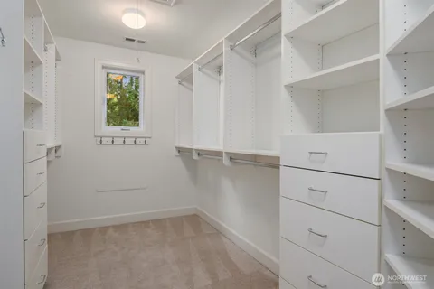 a view of an empty walk in closet