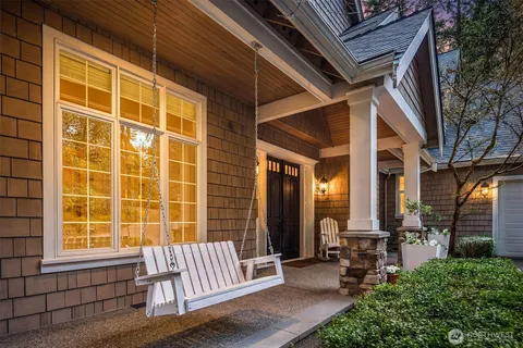 a view of front door with chair and tables