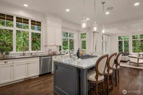 a kitchen with center island and sink
