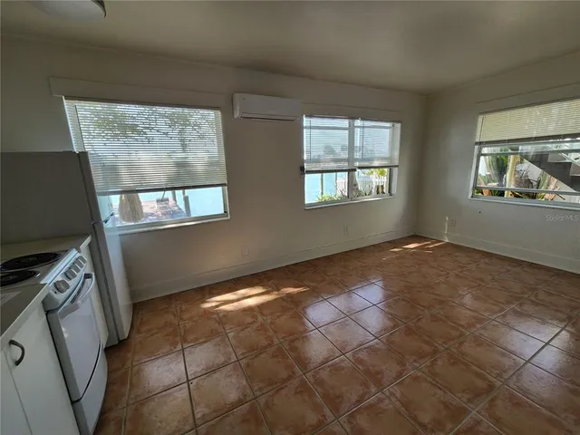 a view of an empty room with windows