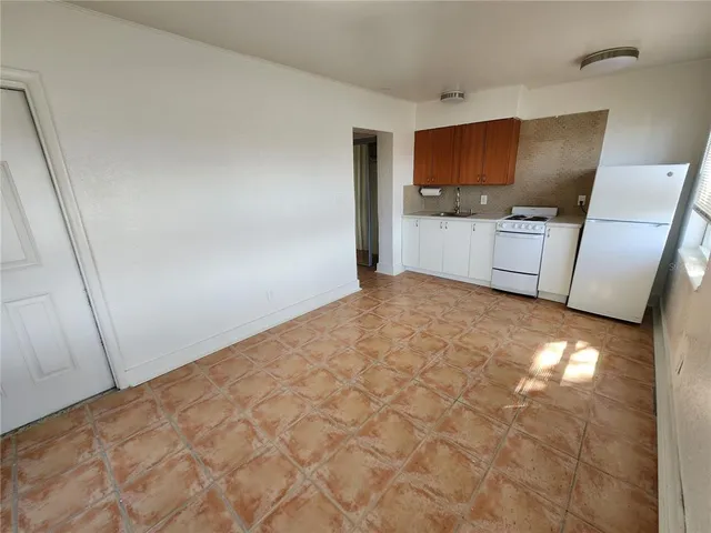 a view of a kitchen with microwave and sink