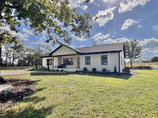 a view of a lake with a big yard