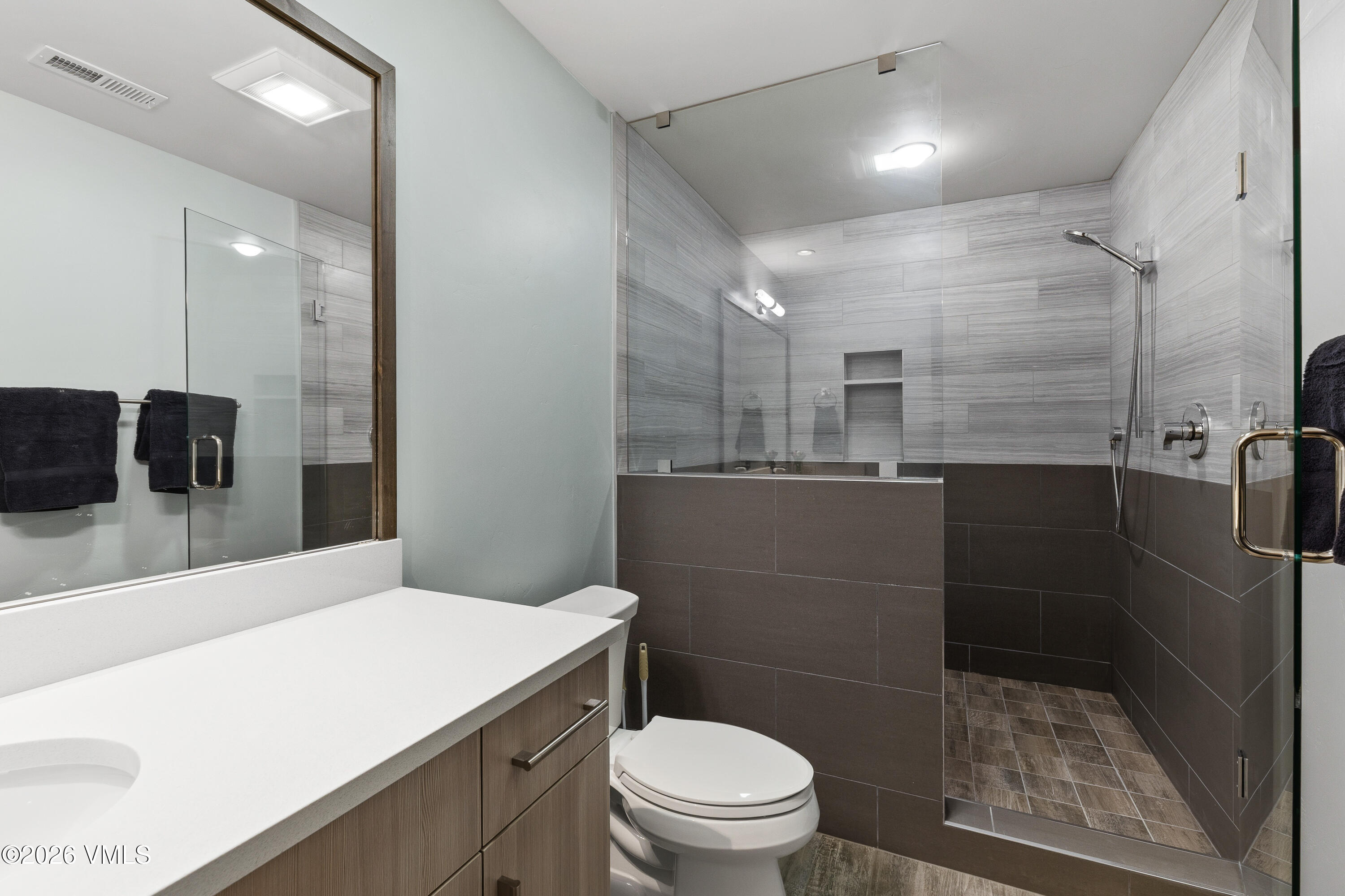 91 Edwards Pointe Edwards, CO 81632 - Photo 28 of 39 a bathroom with a sink a toilet a mirror and shower