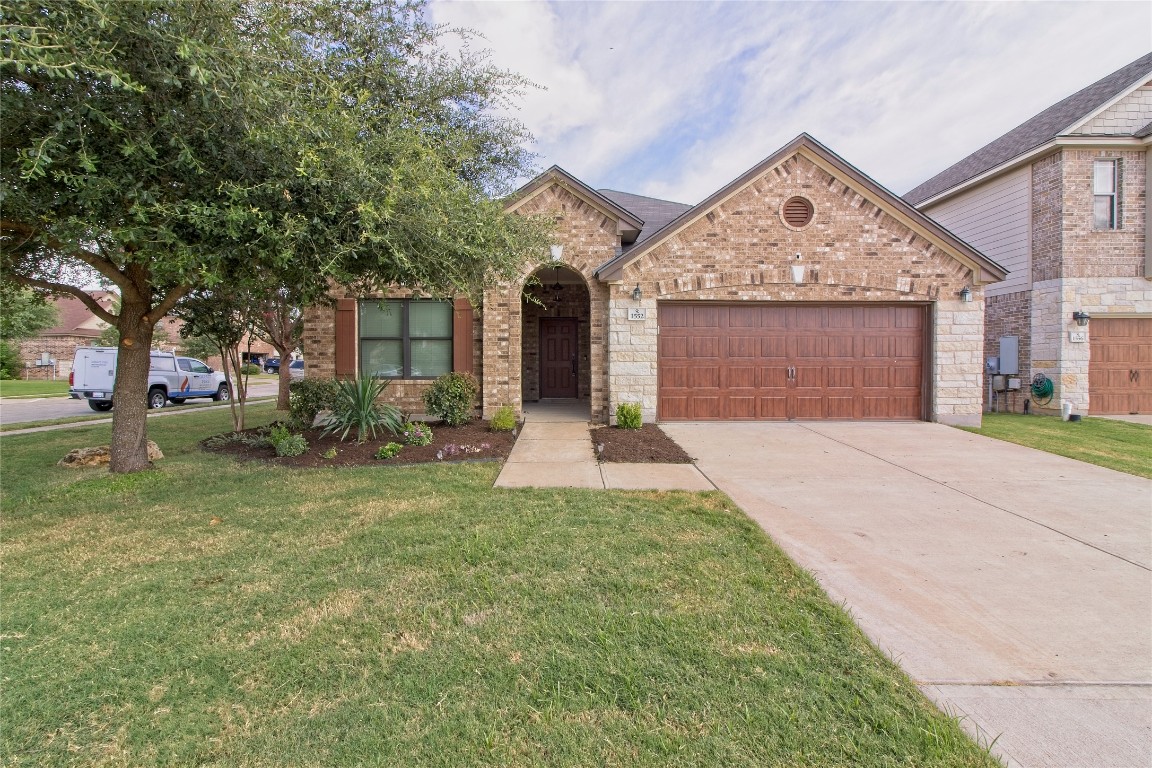 front view of a house with a yard