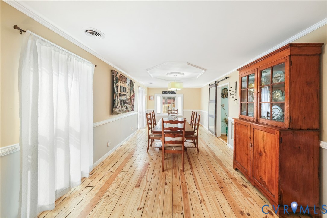 844 Monarch Shores Road Kilmarnock, VA 22482 - Photo 11 of 54 a view of a living room with furniture and wooden floor
