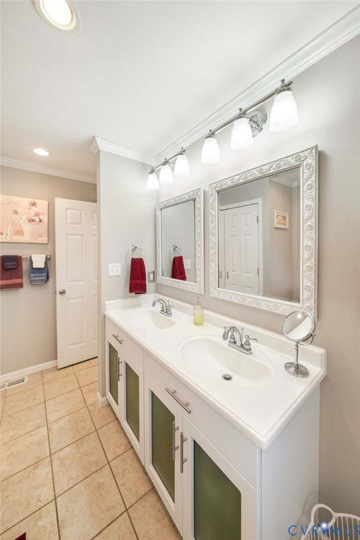 844 Monarch Shores Road Kilmarnock, VA 22482 - Photo 18 of 54 a spacious bathroom with a sink and a mirror