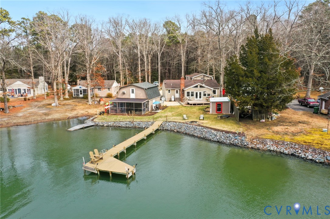 844 Monarch Shores Road Kilmarnock, VA 22482 - Photo 2 of 54 an aerial view of a house with swimming pool and lake view