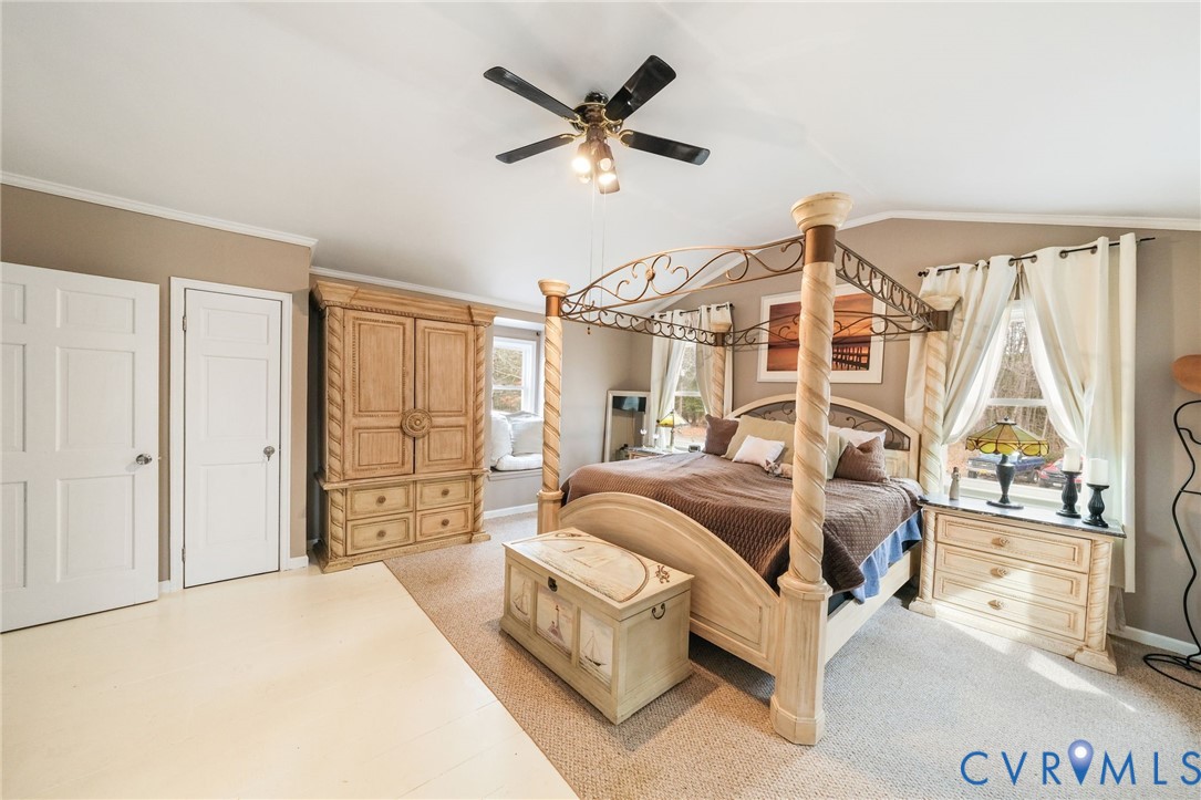 844 Monarch Shores Road Kilmarnock, VA 22482 - Photo 22 of 54 a bed room with a bed and a window