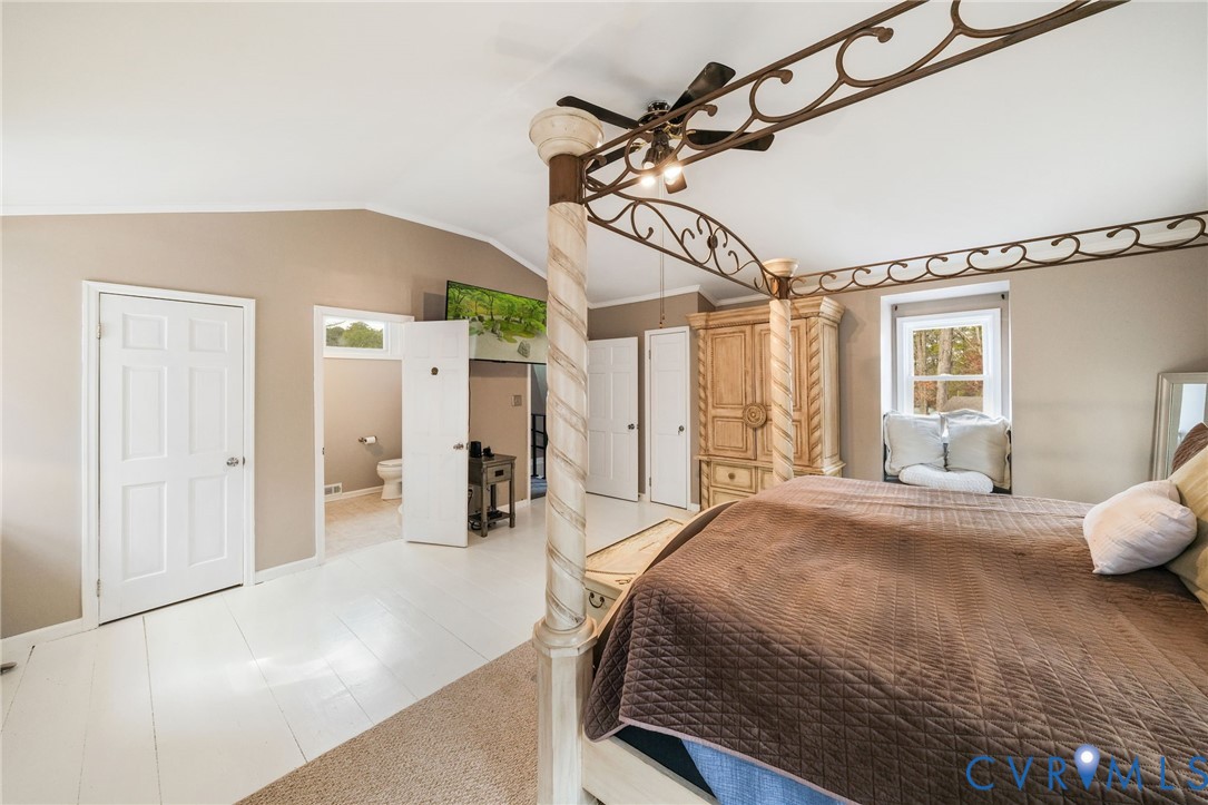 844 Monarch Shores Road Kilmarnock, VA 22482 - Photo 23 of 54 a bedroom with a bed a window and walk in closet