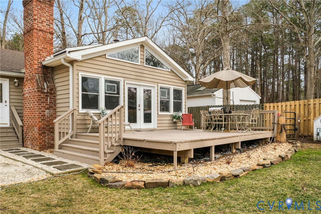 844 Monarch Shores Road Kilmarnock, VA 22482 - Photo 26 of 54 a view of house with a yard and wooden fence