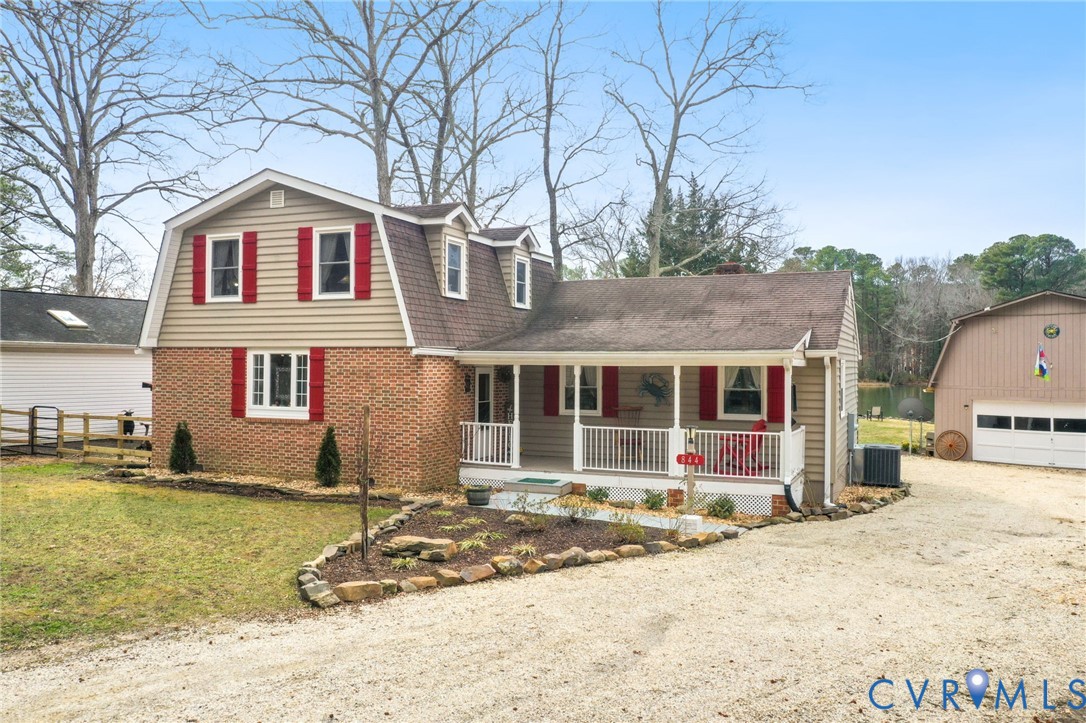 844 Monarch Shores Road Kilmarnock, VA 22482 - Photo 28 of 54 a front view of a house with garden