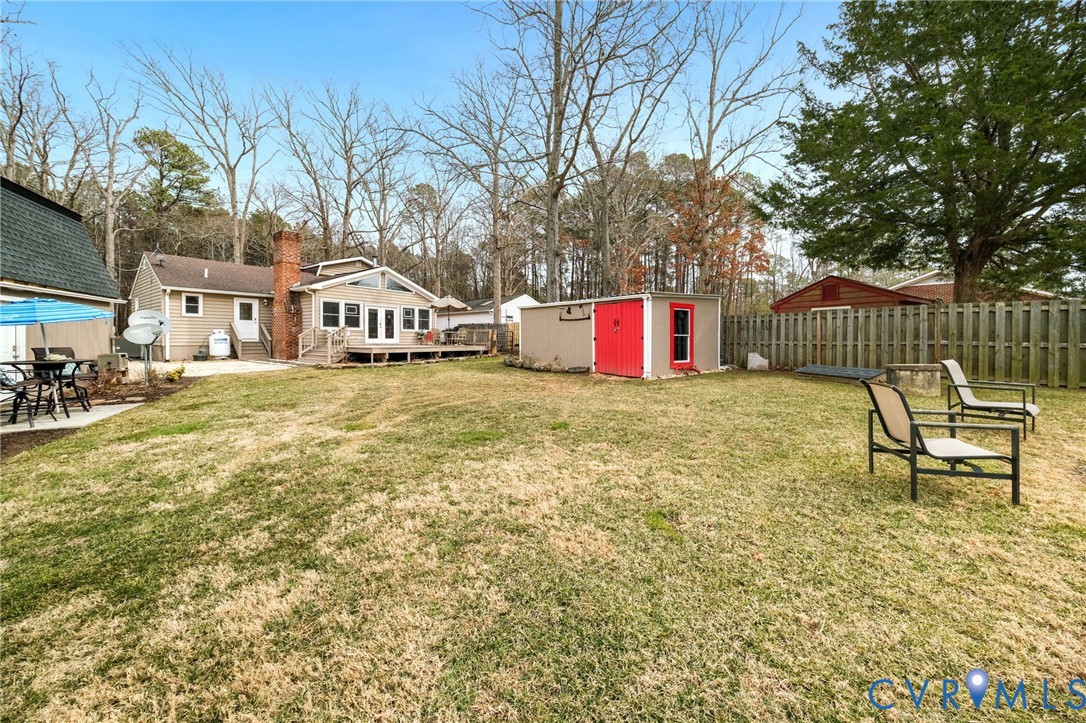 844 Monarch Shores Road Kilmarnock, VA 22482 - Photo 32 of 54 a view of a house with a yard and sitting area