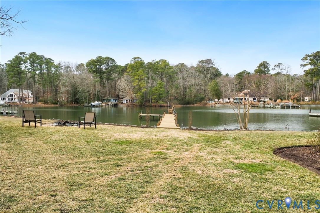 844 Monarch Shores Road Kilmarnock, VA 22482 - Photo 39 of 54 a swimming pool with trees in front of it