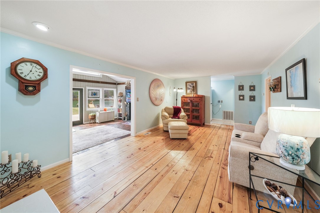 844 Monarch Shores Road Kilmarnock, VA 22482 - Photo 4 of 54 a living room with furniture and a table