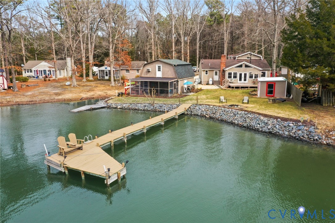 844 Monarch Shores Road Kilmarnock, VA 22482 - Photo 47 of 54 a house with swimming pool in front of it