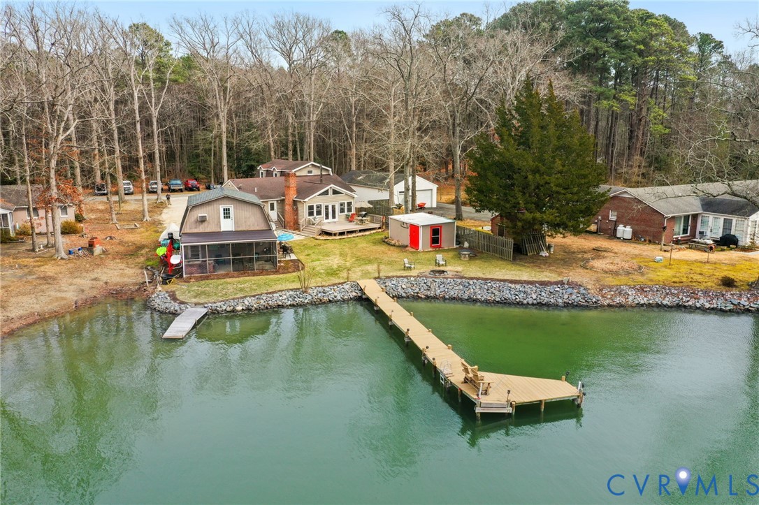 844 Monarch Shores Road Kilmarnock, VA 22482 - Photo 48 of 54 a view of a swimming pool with a lounge chairs