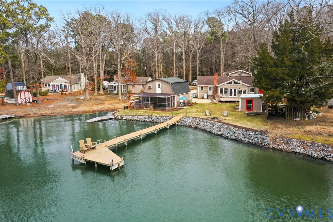 844 Monarch Shores Road Kilmarnock, VA 22482 - Photo 49 of 54 a swimming pool with outdoor seating and yard