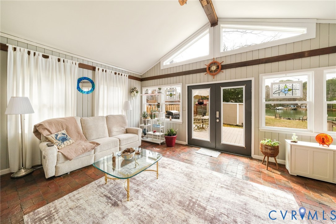 844 Monarch Shores Road Kilmarnock, VA 22482 - Photo 6 of 54 a living room with furniture and a large window