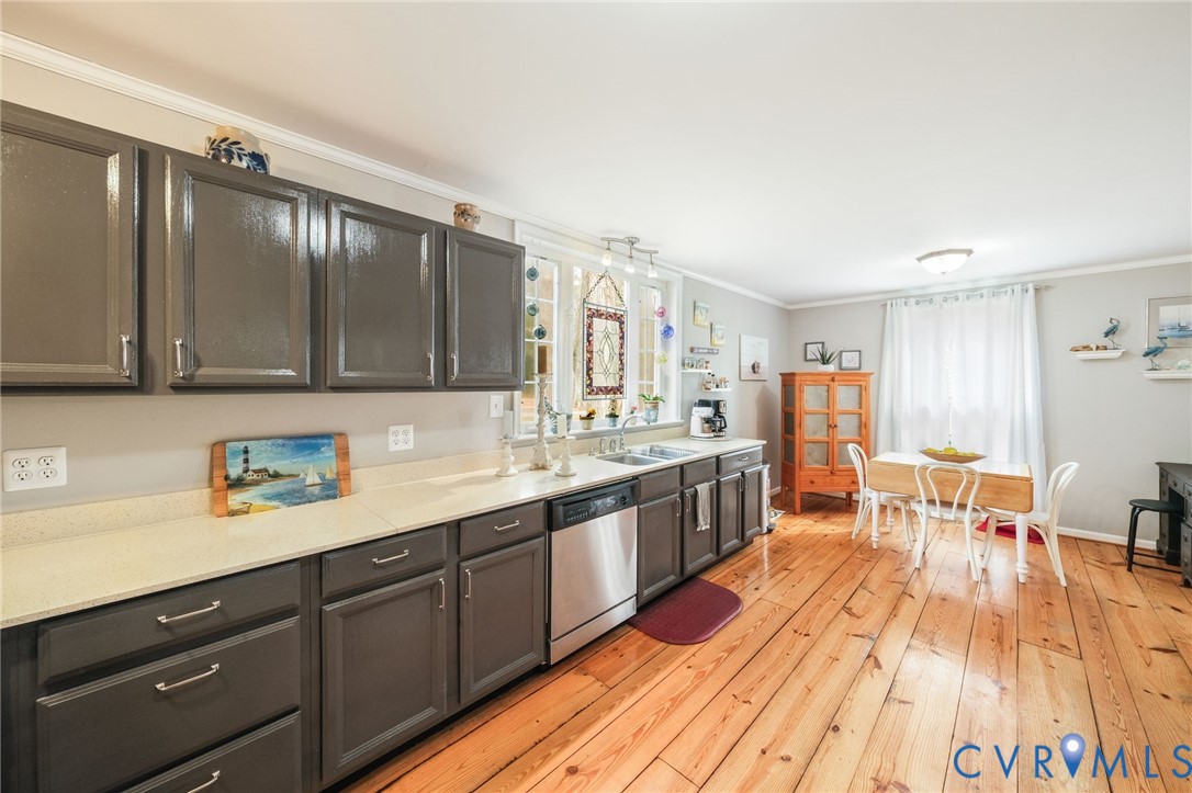 844 Monarch Shores Road Kilmarnock, VA 22482 - Photo 8 of 54 a large kitchen with a sink and cabinets