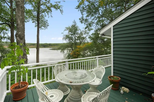 a view of a chair and table in the balcony