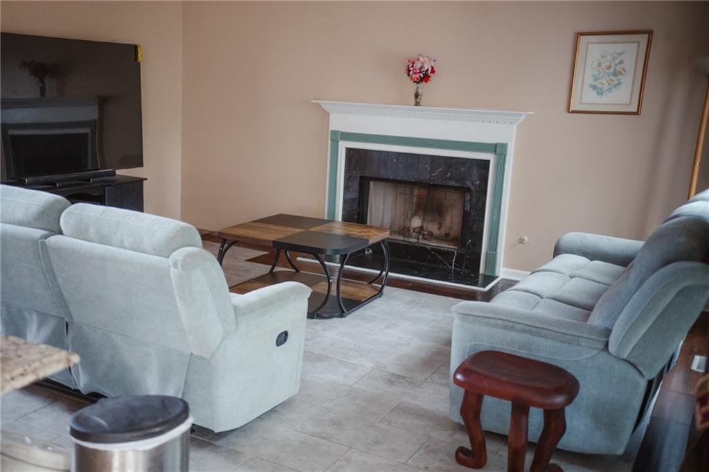 2932 Sunset View Circle Suwanee, GA 30024 - Photo 11 of 44 a living room with furniture and a fireplace