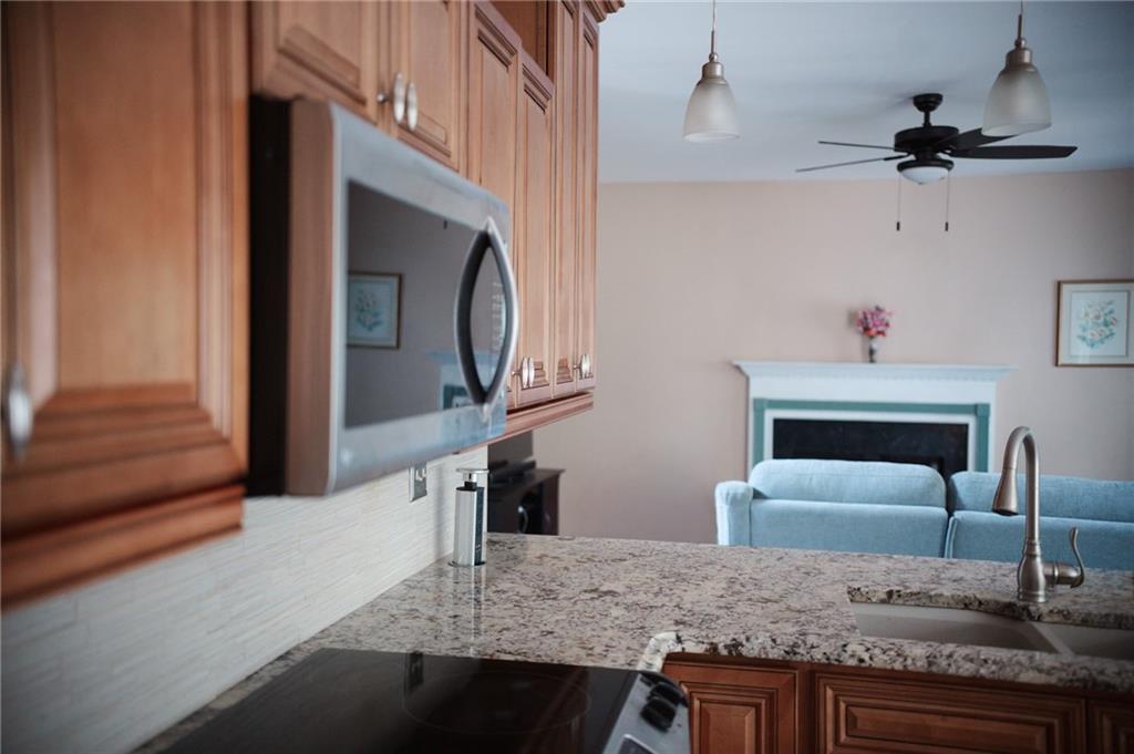 2932 Sunset View Circle Suwanee, GA 30024 - Photo 12 of 44 a living room with furniture and a fireplace