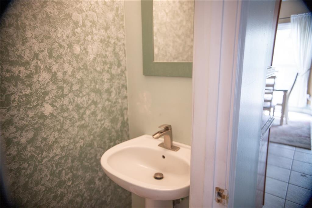 2932 Sunset View Circle Suwanee, GA 30024 - Photo 20 of 44 a bathroom with a sink a mirror and a shower