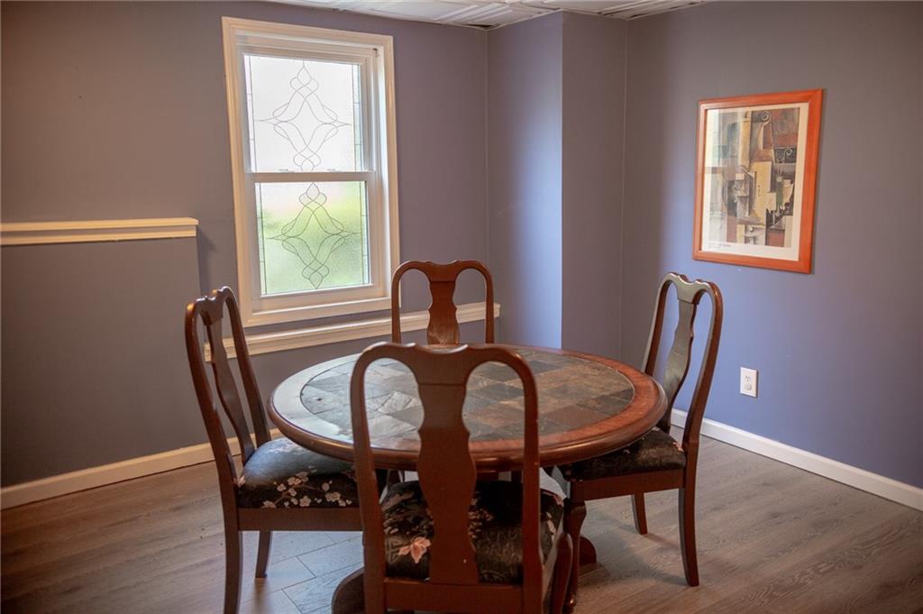 2932 Sunset View Circle Suwanee, GA 30024 - Photo 27 of 44 a view of a dining room with furniture and window