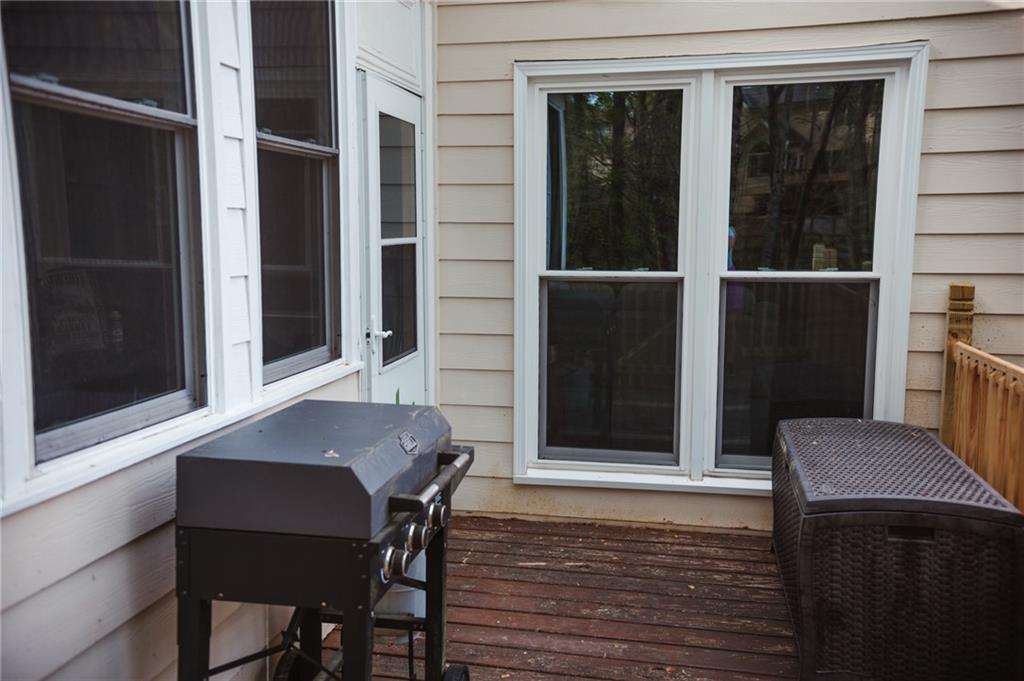 2932 Sunset View Circle Suwanee, GA 30024 - Photo 40 of 44 a view of a balcony with table and chairs