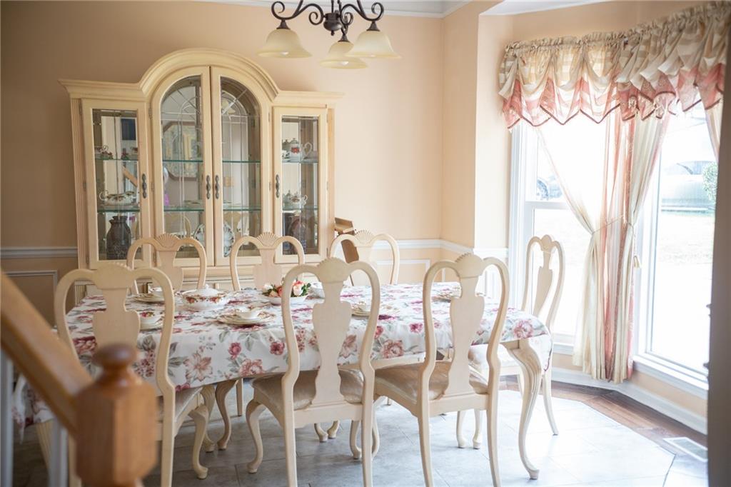 2932 Sunset View Circle Suwanee, GA 30024 - Photo 4 of 44 a view of a dining room with furniture and windows