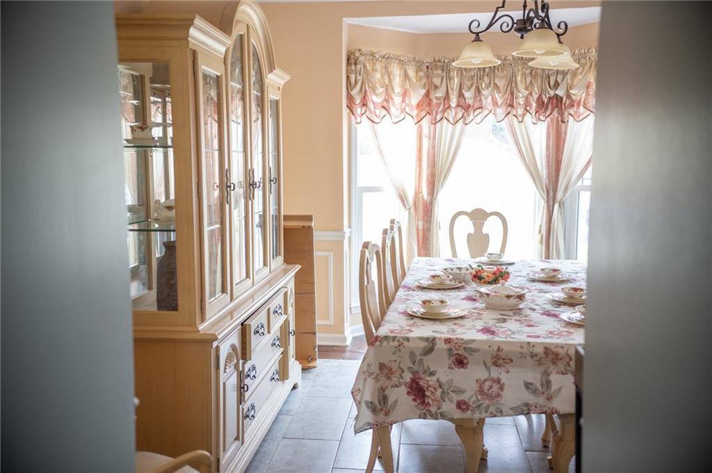 2932 Sunset View Circle Suwanee, GA 30024 - Photo 5 of 44 a view of a very nice looking dining room with a table and chairs