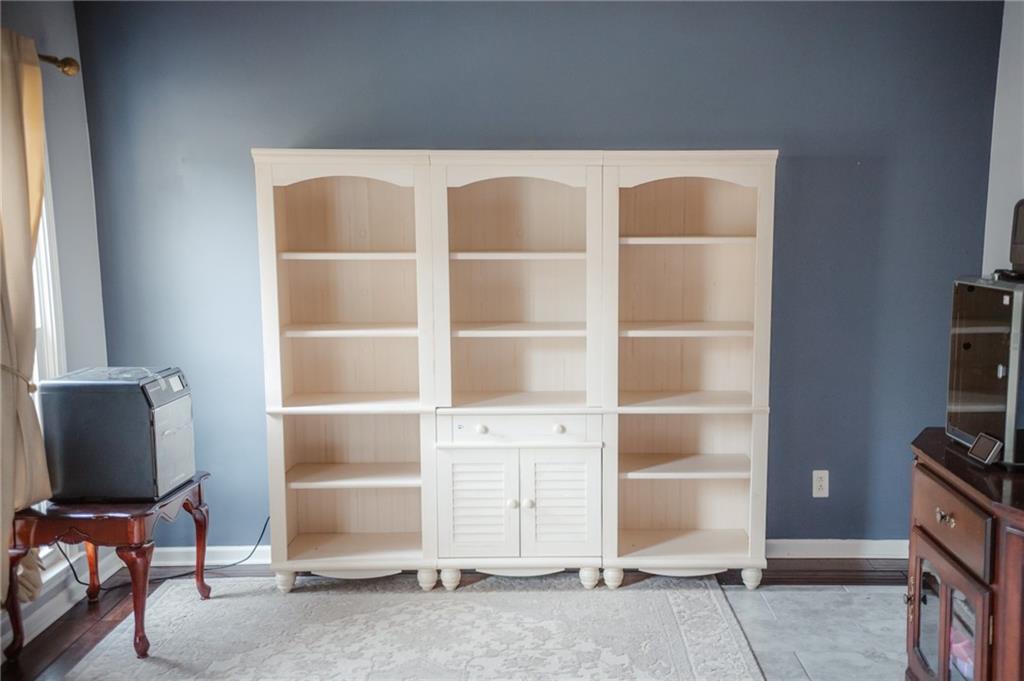 2932 Sunset View Circle Suwanee, GA 30024 - Photo 6 of 44 a room with a chair and a window