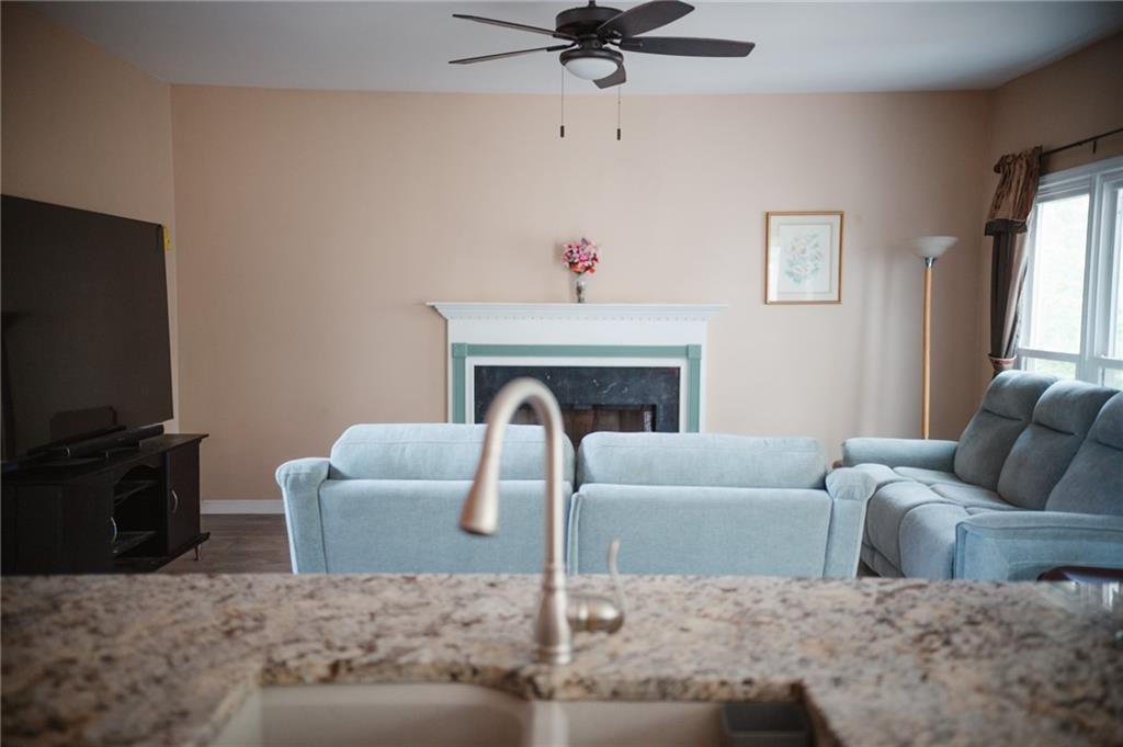 2932 Sunset View Circle Suwanee, GA 30024 - Photo 10 of 44 a living room with furniture and a fireplace