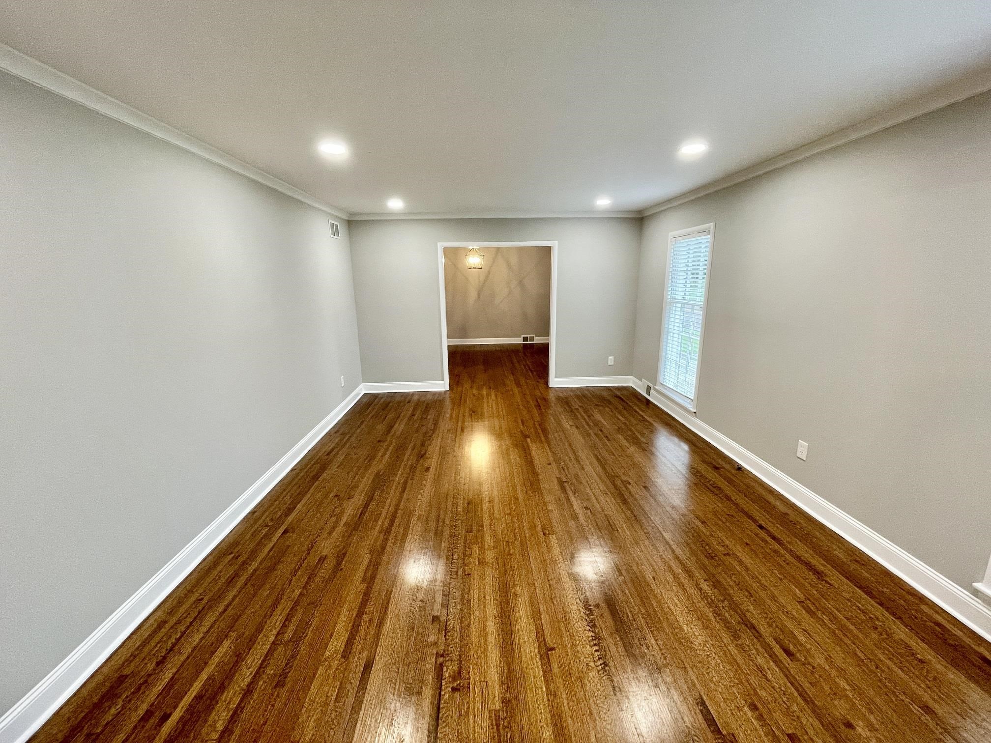 5523 Walnut Grove Road Memphis, TN 38120 - Photo 15 of 21 a view of wooden floor in a room