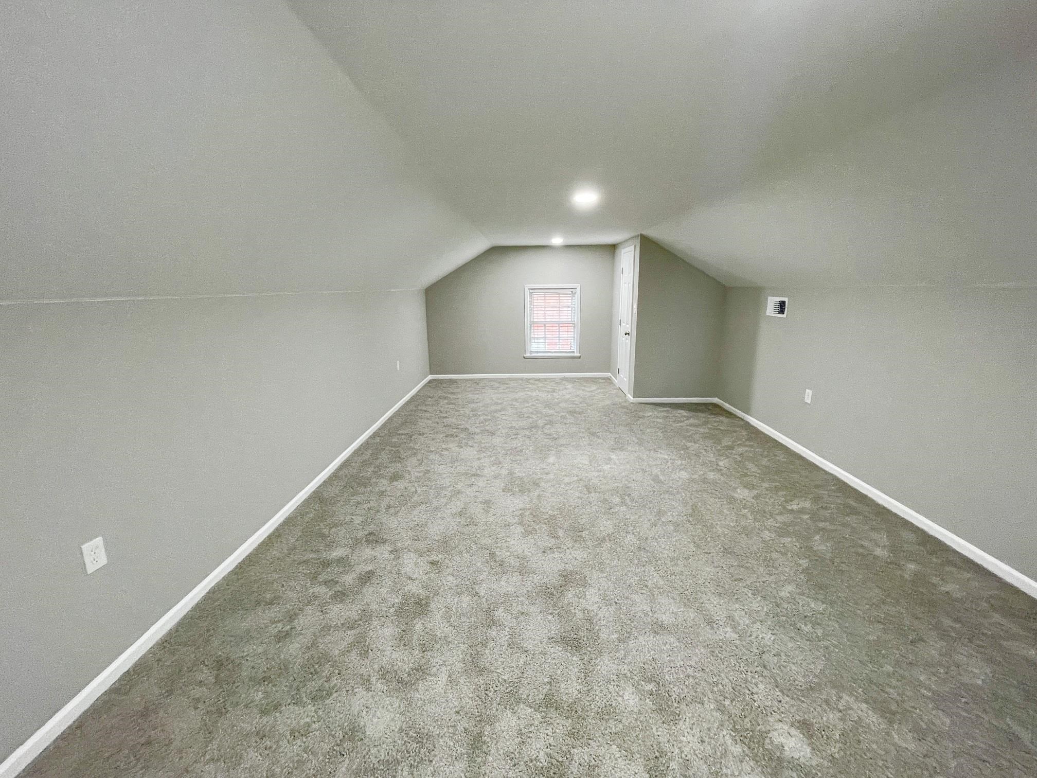 5523 Walnut Grove Road Memphis, TN 38120 - Photo 20 of 21 a view of an empty room and window
