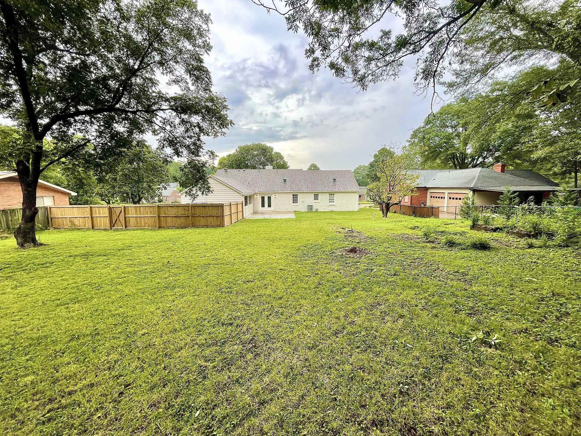5523 Walnut Grove Road Memphis, TN 38120 - Photo 3 of 21 a view of a house with a big yard