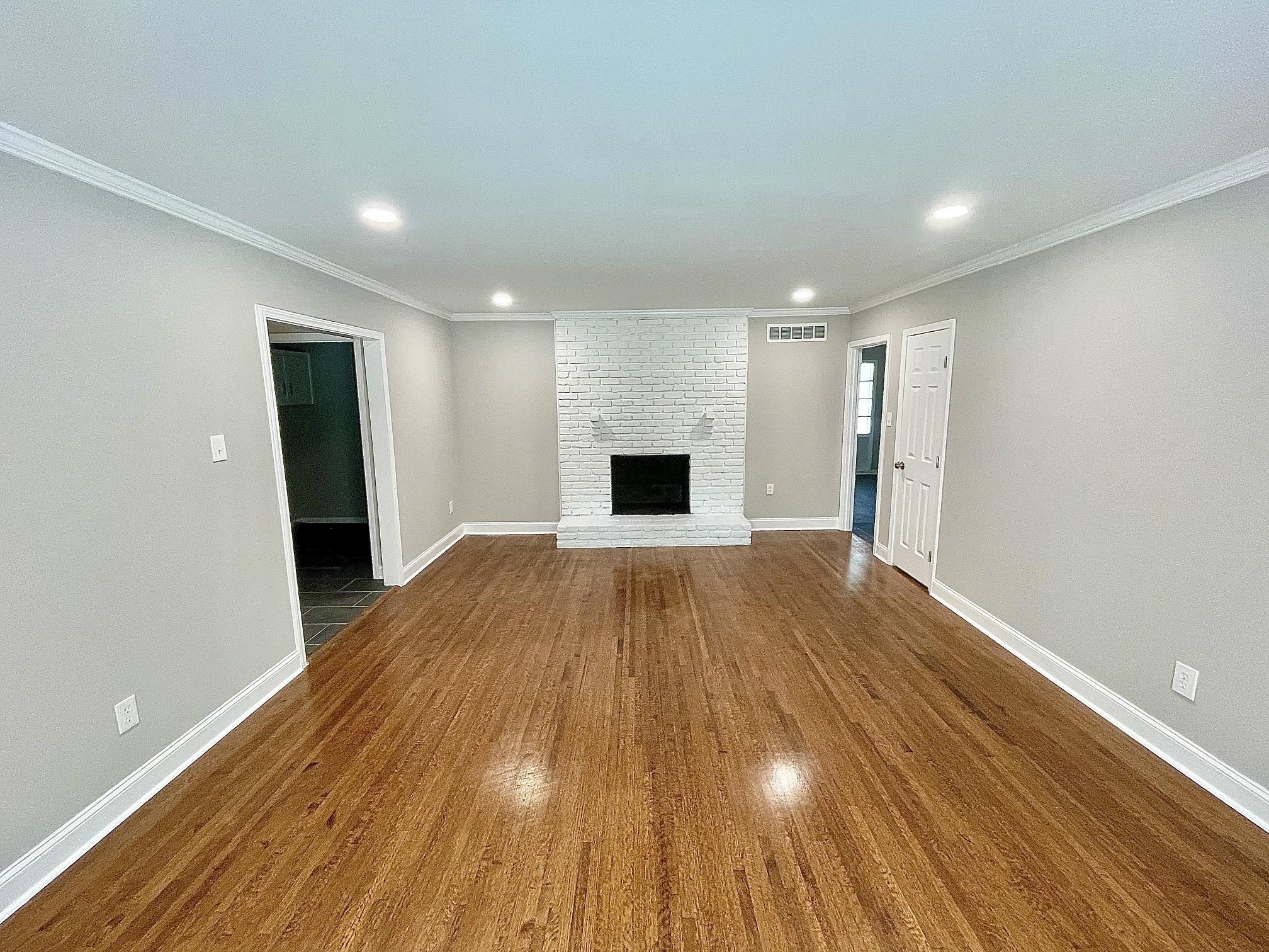 5523 Walnut Grove Road Memphis, TN 38120 - Photo 5 of 21 a view of empty room with wooden floor