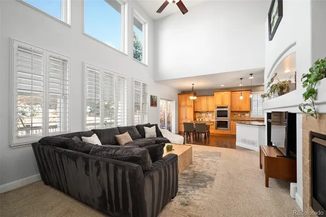 a spacious bedroom with a bed and a chandelier