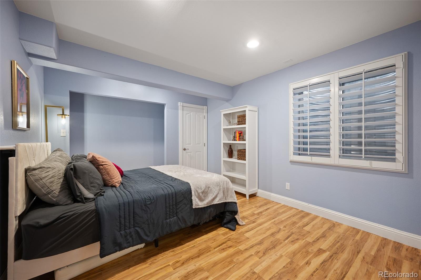 3559 Craftsbury Drive Highlands Ranch, CO 80126 - Photo 28 of 38 a bedroom with a bed and wooden floor