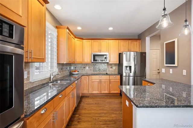 a living room with furniture fireplace and a large window