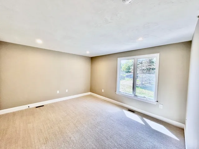 a view of a closet with wooden floor