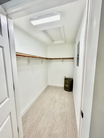 a bathroom with a sink mirror and vanity