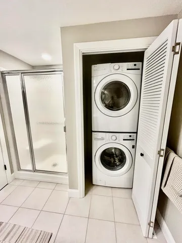 a bathroom with a sink a mirror and a shower
