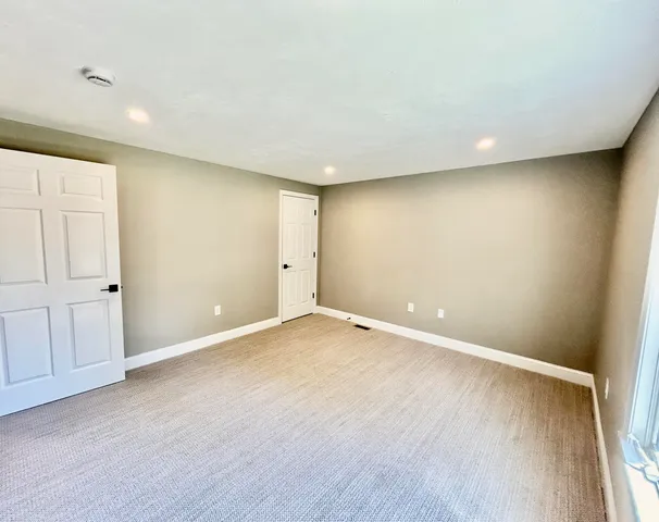 a bathroom with a sink mirror toilet and shower