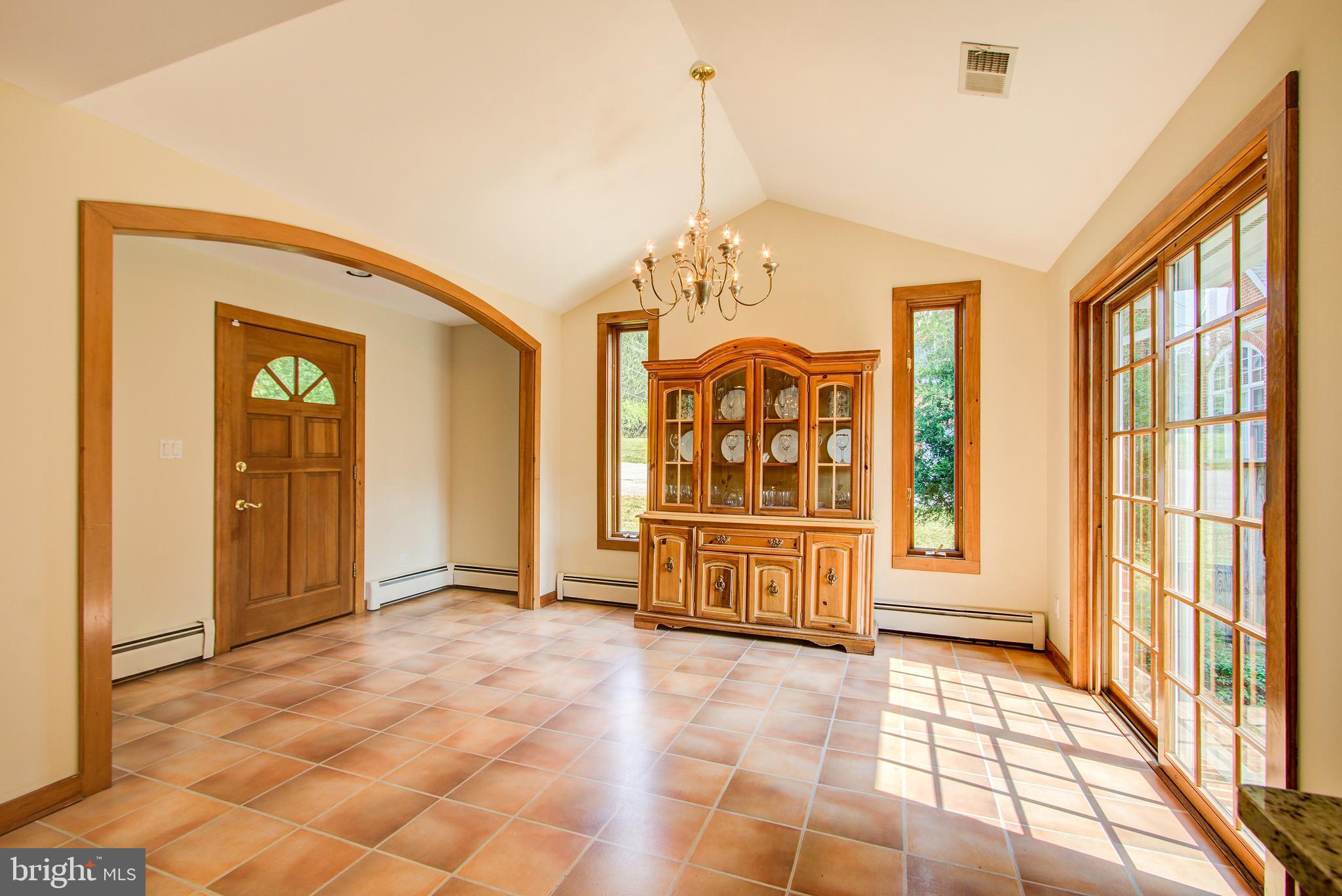 Dining Room with Second Foyer & Access to Driveway