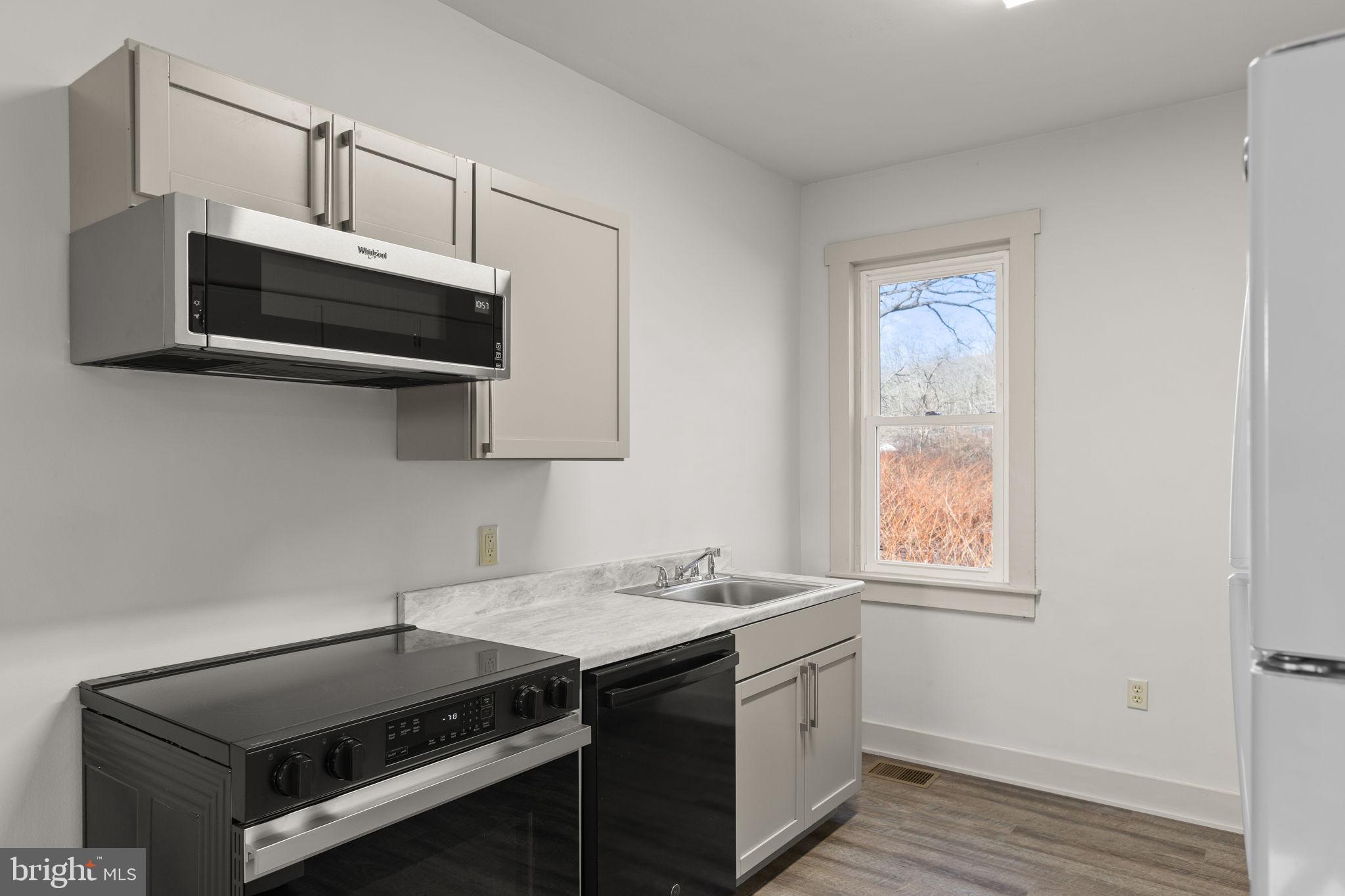 1586 Schwaben Creek Road Dornsife, PA 17823 - Photo 12 of 39 a kitchen that has a sink and a stove