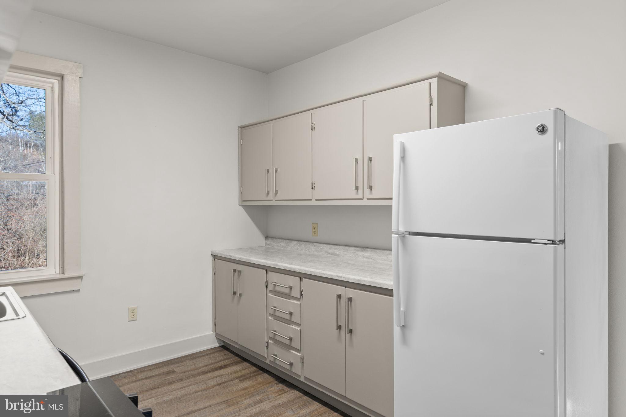 1586 Schwaben Creek Road Dornsife, PA 17823 - Photo 14 of 39 a white refrigerator freezer sitting inside of a kitchen